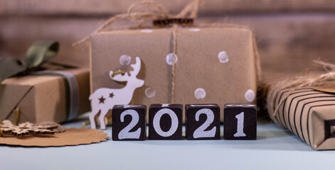 New Year and Christmas festive background concept decoration with gifts, deer figurine and 2021 year figures