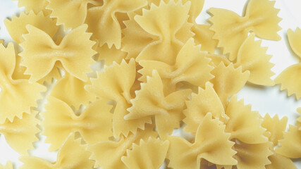 heap of Italian pasta Farfalle in a bright environment,close up