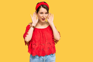 Fototapeta na wymiar Young brunette woman with short hair wearing casual summer clothes and diadem trying to hear both hands on ear gesture, curious for gossip. hearing problem, deaf