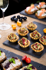 Christmas tapas with cheese balls and white wine, New year celebration, toasts for party dinner