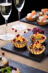 Christmas tapas with cheese balls and white wine, New year celebration, toasts for party dinner