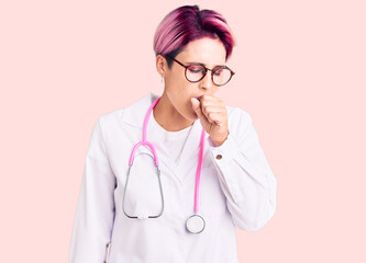 Young beautiful woman with pink hair wearing doctor uniform feeling unwell and coughing as symptom for cold or bronchitis. health care concept.