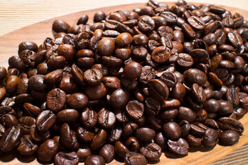 coffee beans on the wooden plate