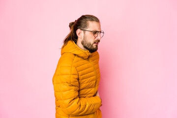 Young man with long hair look having a liver pain, stomach ache.