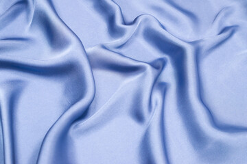 Obraz premium Blue silk or satin luxury fabric texture. Top view.