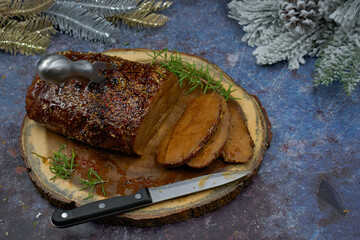 Vegan seitan roast rubbed with spices and bbq sauce on wooden board, sliced, copy space