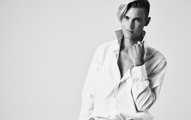 elegant man in shirt with tie light background portrait cropped view