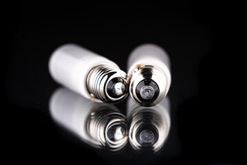 two light bulbs for professional studio lighting on a black background