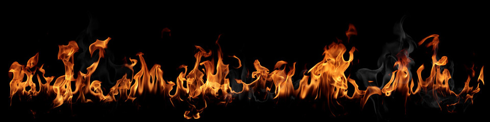 Texture of real fire flames and sparks isolated on black background