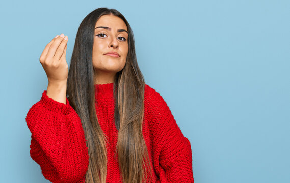 Beautiful hispanic woman wearing casual clothes doing italian gesture with hand and fingers confident expression