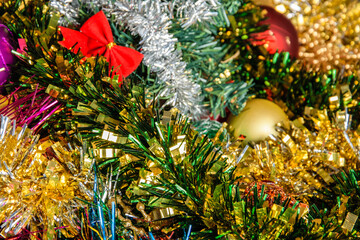Obraz na płótnie Canvas Background of multi-colored shining Christmas decorations close-up.