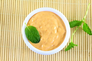 traditional home made ranch dressing isolated in bowl with mint