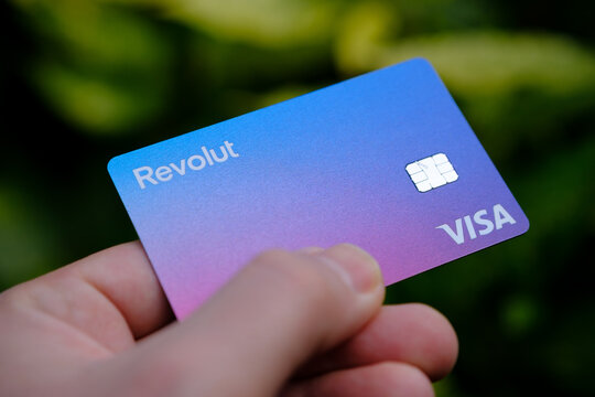 Stone / United Kingdom - April 14 2020: Revolut Bank card. The rebranded  VISA card with new updated Revolut logo hold in hand. Digital virtual bank.  Stock Photo | Adobe Stock