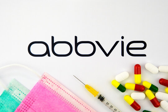 Stone / United Kingdom - February 12 2020: Abbvie company logo seen on the brochure with the viral masks, syringe and pills. Concept photo.