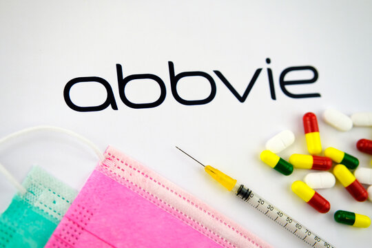 Stone / United Kingdom - February 12 2020: Abbvie company logo seen on the brochure with the viral masks, syringe and pills. Concept photo. Selective focus.