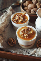 Vanilla dessert with caramel and walnuts, two portions