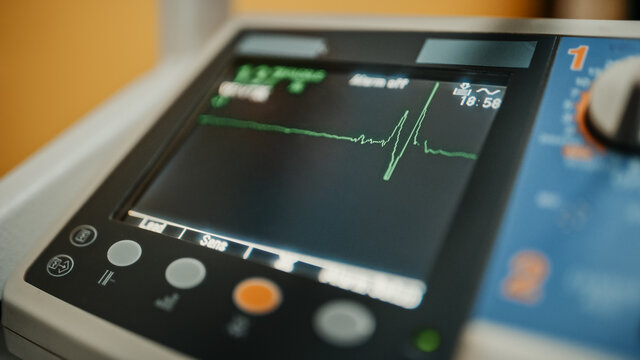 Vital Signs Monitor Showing Heart Rate And Other Medical Parameters On A Digital Display. Patient's Vitals On A Screen In Healthcare Hospital. ECG Graph On Intensive Care Unit.