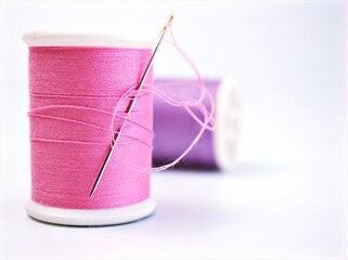 sewing thread and needle ,Sewing spool of thread and scissors isolated on white background