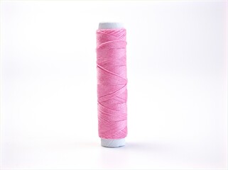 pink needle and thread ,Sewing spool of thread and scissors isolated on white background	