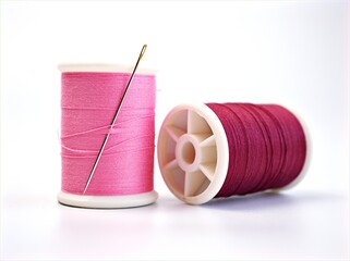 sewing thread and needle ,Sewing spool of thread and scissors isolated on white background	