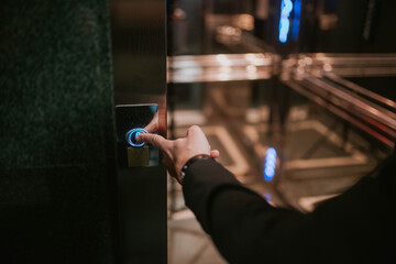 Businessman's finger on the elevator button © Razoran