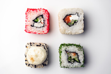 four pieces of sushi on a white background. the view from the top