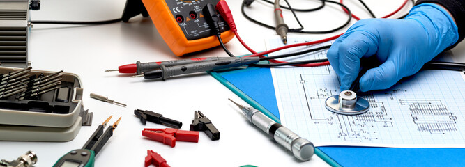 Electronics repair service-the master checks the electronic unit and performs electrical...