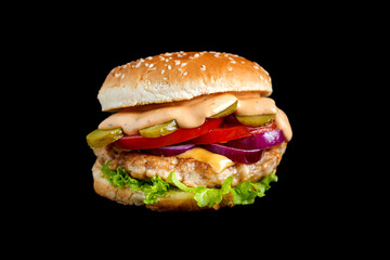 Burger with meat on black background