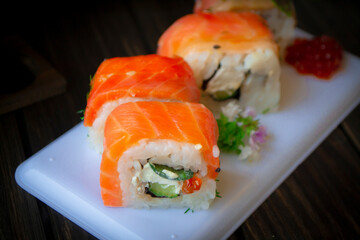 Philadelphia roll sushi with salmon, prawn, avocado, cream cheese.
