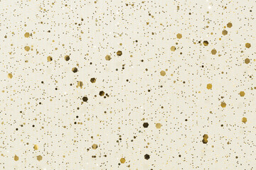Holiday sparkle background with gold glitter confetti on white.