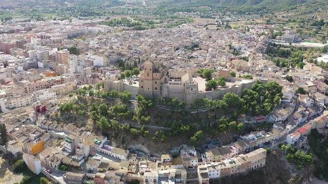 Picturesque aerial view of historic center of small Spanish town of Caravaca de la Cruz on sunny autumn day, Murcia. High quality 4k footage