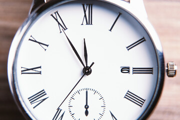 Elegant wrist watch closeup on dark