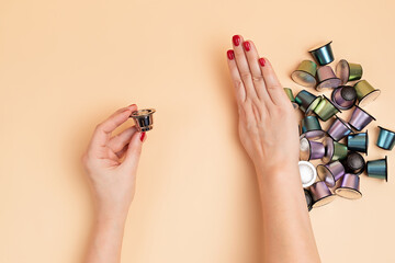 Resusable and refillable coffee capsule choice versus disposable aluminium capsules. Ethical consuption, sustainable lifestyle, zero waste living