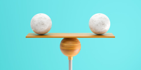 wooden scale balancing two big balls on grey background