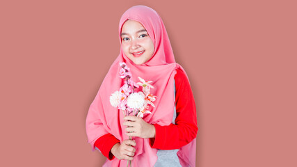 picture of young Asian muslim woman with flower