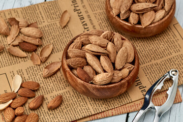 Almond kernels-roasted salted almonds lie on a light background.