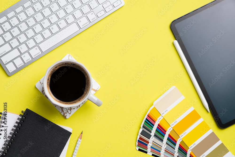Fototapete designer desk top view with computer keyboard, graphic tablet color palette, notebook, cup of coffee