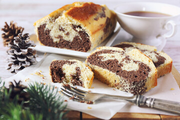 New Year baking. Homemade traditional marble cake and cup of tea