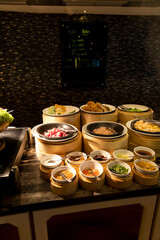 Thai noodle soup station, bowls with ingredients, toppings and sauces