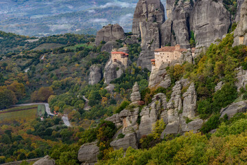 Roussanou and Αgios Nikolaos monastery, an unesco world heritage site,  located on a unique rock formation  above the village of Kalambaka during fall season.