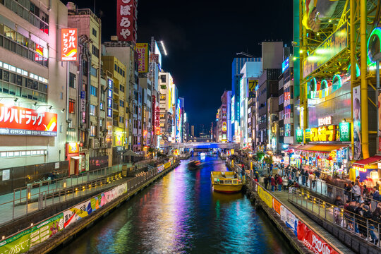 Dotonburi,the famous attraction with full of advertising sign and popular Glico Man billboard and canal.A lot of tourist come to shopping at here:OSAKA,JAPAN-NOVEMBER 17, 2018