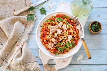 Spanish cuisine. Tuna and fried chickpeas with tomatoes and olives, parsley dressing