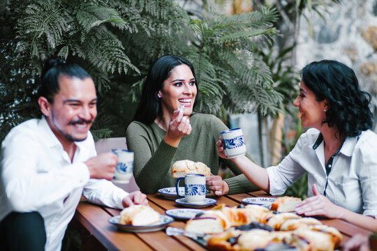 Mexican Friends Eating Rosca De Reyes Or Epiphany Cake, Roscon De Reyes With Traditional Mexican Chocolate Cup