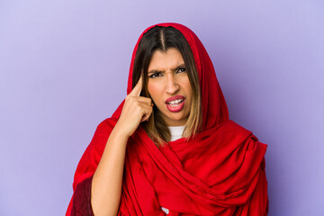 Young indian woman wearing a hijab isolated showing a disappointment gesture with forefinger.