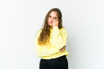 Young caucasian woman who feels sad and pensive, looking at copy space.