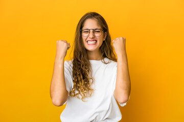 Young caucasian woman cheering carefree and excited. Victory concept.