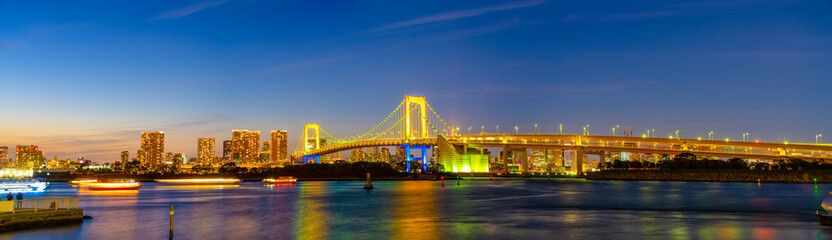 Fototapeta na wymiar Panorama of rainbow bridge near Tokyo bay. Japan