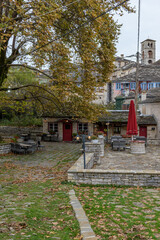 Fototapeta premium The picturesque village of Dilofo during fall season with its architectural traditional old stone buildings located on Tymfi mount, Zagori, Epirus, Greece, Europe 