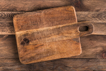 Cutting board on wooden table.