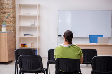 Young male student in business presentation concept